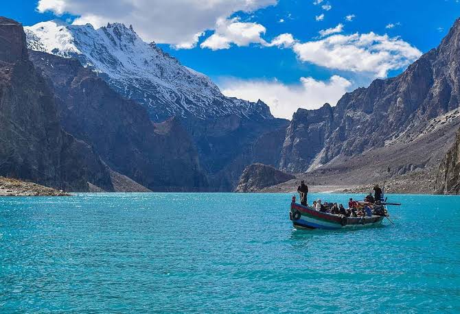 Turquoise waters of Attabad Lake between steep mountains in upper Hunza